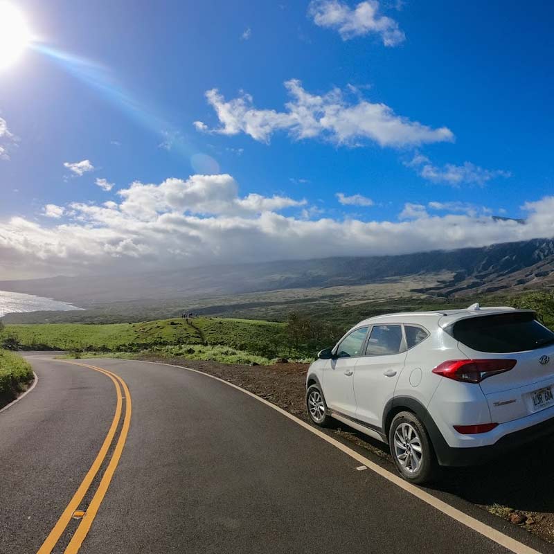 Rental car parked on a road in Hawaii